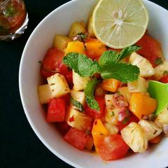 A picture of Watermelon Pineapple Salad With Honey Lime Mint Dressing.