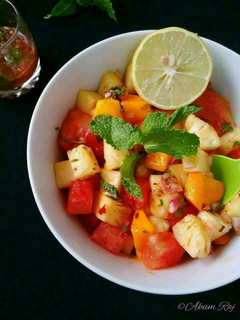 A picture of Watermelon Pineapple Salad With Honey Lime Mint Dressing.