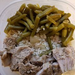 A picture of Caribbean jerk pork with rice and green beans in crock pot.