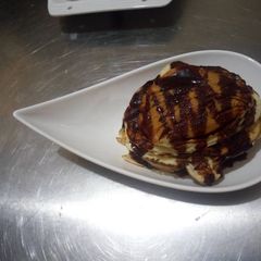 A picture of Pancake with chocolate syrup.