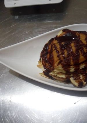 A picture of Pancake with chocolate syrup.