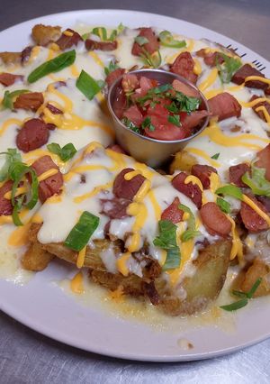 Una foto de Papas Gajo con Mozzarella y Tocino