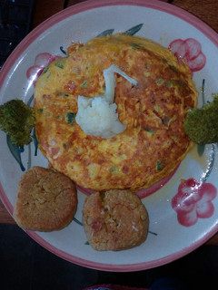 Una foto de Tortilla de zanahoria, zapallito y calabacín
