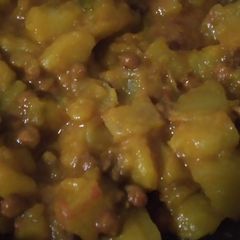 Green papaya with black chana and potatoes A picture of Green papaya with black chana and potatoes.