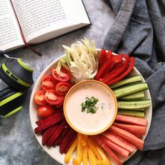 A picture of Fresh veggies with Yogurt Sriracha dip.