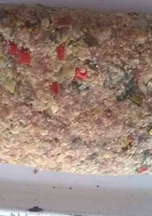 Una foto de Enrollado de carne picada con relleno de queso, jamón y huevo