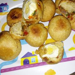 A picture of Egg rolls with sauce.
