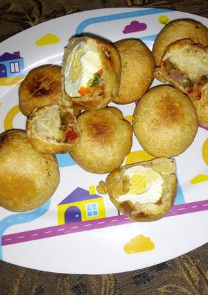 A picture of Egg rolls with sauce.