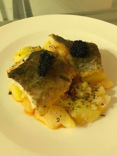 Una foto de Bacalao con base de patatas