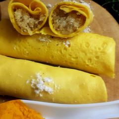 A picture of Surul /churul appam (coconut crepe roll).