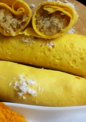 A picture of Surul /churul appam (coconut crepe roll).