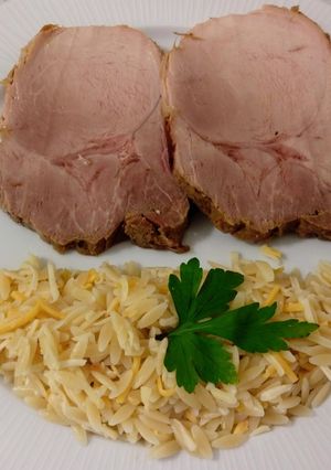 A picture of Pedro Ximénez Braised Pork Loin with Kritharaki Pasta and Cheese.