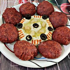 A picture of Beetroot-broccoli falafal and hummus.
