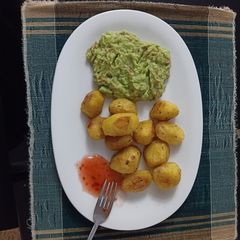 A picture of Baked Potatoes with Guacamole.