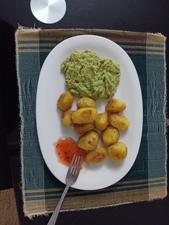 A picture of Baked Potatoes with Guacamole.