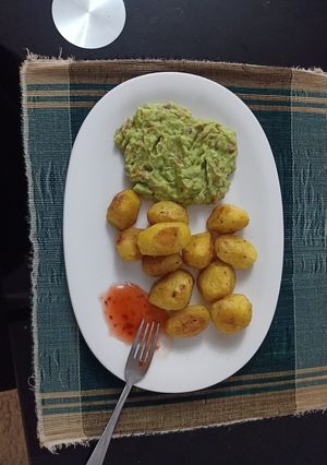 A picture of Baked Potatoes with Guacamole.