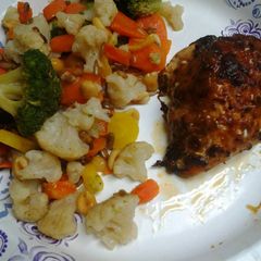 A picture of Roasted, Spiced, and herb crusted chicken with buttery vegetables.