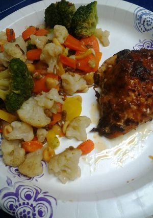 A picture of Roasted, Spiced, and herb crusted chicken with buttery vegetables.