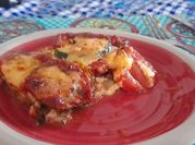 Una foto de lasagna de berenjena y zapallito