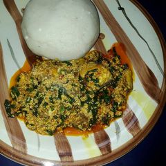 A picture of Pounded yam and egusi soup.