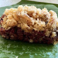 A picture of Coconut Flavored Purple Sticky Rice with Sweet Coconut and Dried Longan.