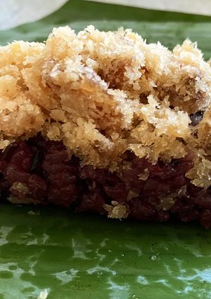 A picture of Coconut Flavored Purple Sticky Rice with Sweet Coconut and Dried Longan.