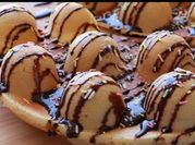 A picture of waffles with powdered sugar