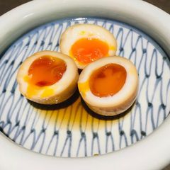 A picture of Ajitama “half boiled seasoned egg”.