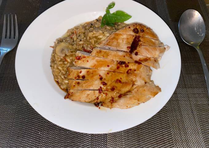 Spicy risotto with mushrooms and glazed chicken breast