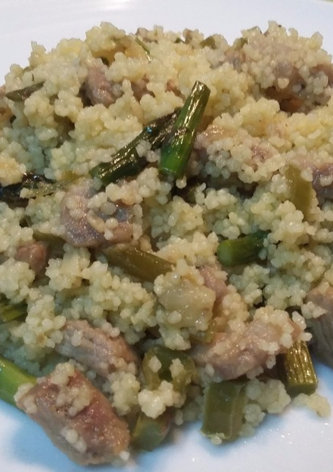 Una foto de Cous cous con presa ibérica