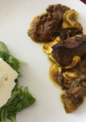 A picture of Pork zucchini & valerian salad with greek feta.