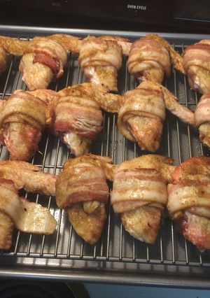A picture of Chicken wings with bacon.