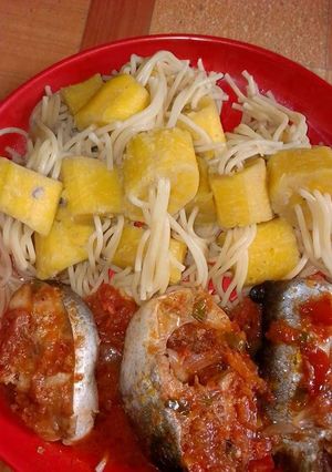 A picture of Spagetti with boiled plantain and fish.