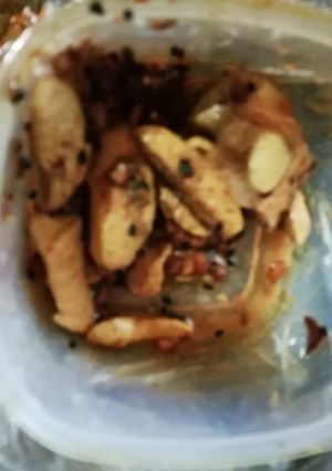 A picture of Achari aloo wedges.