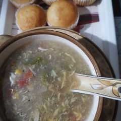 Chicken corn veggie soup with cup cake A picture of Chicken corn veggie soup with cup cake.