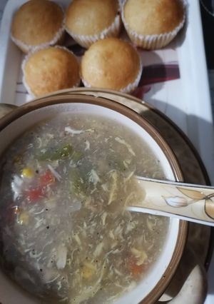 A picture of Chicken corn veggie soup with cup cake.