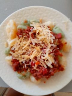 Una foto de Ñoquis de papa con salsa de tomate: