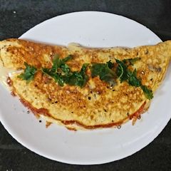 A picture of My Nice And Easy Cheese, Onion + Tomato Omelette 🥰.