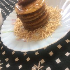 A picture of Jowar Atta pancakes with dates coconut sauce.