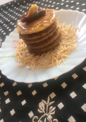 A picture of Jowar Atta pancakes with dates coconut sauce.