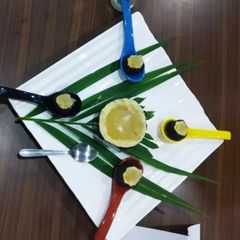 A picture of Sweet coconut filled with glass pudding.