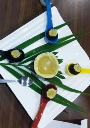 A picture of Sweet coconut filled with glass pudding.
