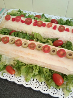 Una foto de Pionono relleno de jamón y queso