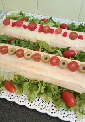 Una foto de Pionono relleno de jamón y queso