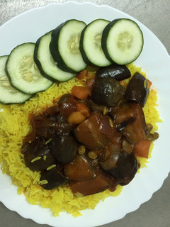 A picture of Turmeric Rice with Eggplant Sauce.