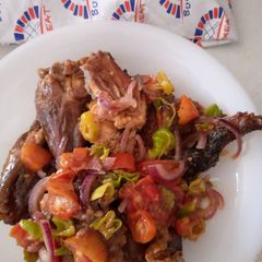 A picture of Smoked guinea fowl tomato stir fry.
