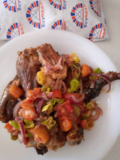 A picture of Smoked guinea fowl tomato stir fry.