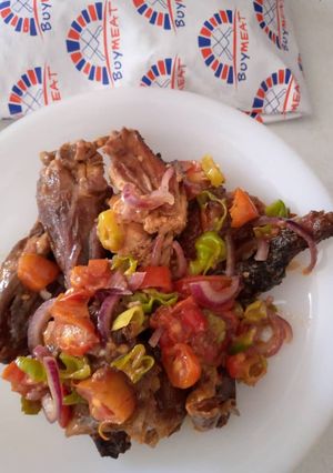 A picture of Smoked guinea fowl tomato stir fry.