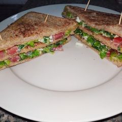 A picture of The perfect club sandwich for a working morning.