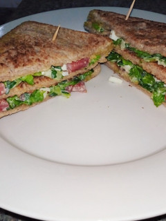 A picture of The perfect club sandwich for a working morning.